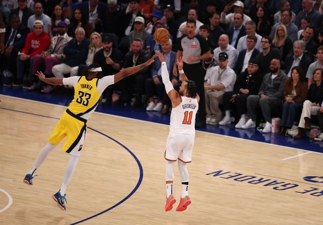 NEW YORK, NEW YORK - MAY 29: Jalen Brunson #11 of the New York Knicks hits a three point shot in the second quarter against Myles Turner #33 of the Indiana Pacers during Game 5 of the Eastern Conference Finals at Madison Square Garden on May 29, 2025 in New York City.