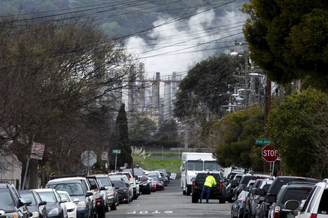 Smoke rises from the Chevron petroleum refinery next to a residential neighborhood in Richmond, in March. The refinery flared Saturday for the third time in May. 