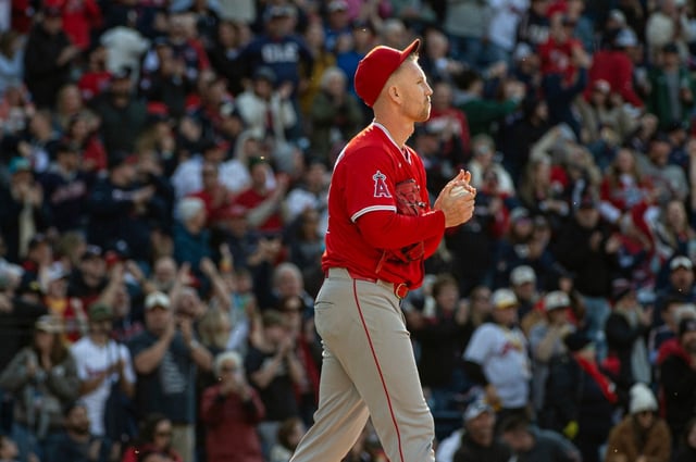 Angels relief pitcher Ryan Zeferjahn walks back to the mound after giving up a solo home run to Cleveland’s Carlos Santana during the seventh inning Saturday, May 31, 2025, in Cleveland. (AP Photo/Phil Long)