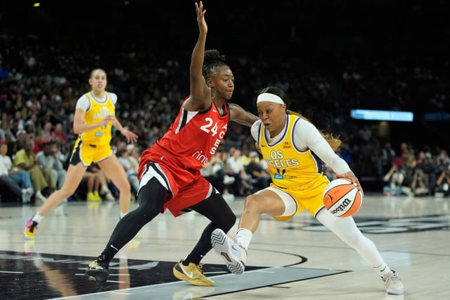Sparks guard Odyssey Sims drives against Las Vegas guard Jewell Loyd during the first half Friday, May 30, 2025, in Las Vegas. (AP Photo/John Locher)
