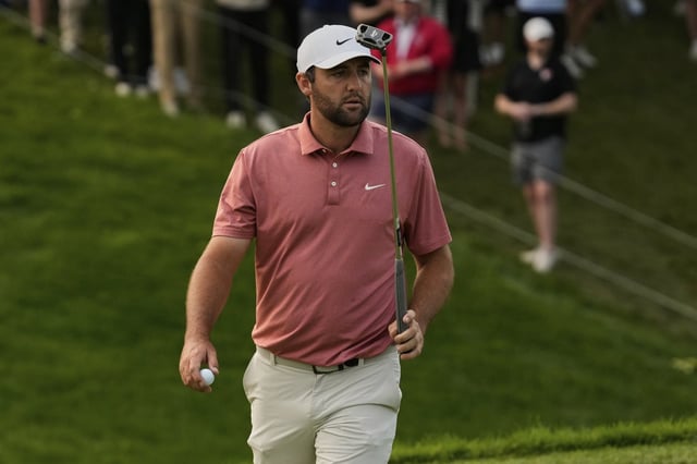 Scottie Scheffler gestures after his putt on the 18th green during the third round of the Memorial golf tournament Saturday, May 31, 2025, in Dublin, Ohio. (AP Photo/Sue Ogrocki)