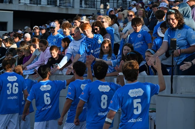 Annapolis Blues players greet fans after the win. The Annapolis Blues FC take on Christos FC in men’s soccer Saturday at Navy-Marine Corps Memorial Stadium in the Blues season home opener. (Paul W. Gillespie/Staff)