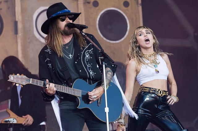 GLASTONBURY, ENGLAND - JUNE 30: Billy Ray Cyrus and Miley Cyrus perform on the Pyramid stage on day five of Glastonbury Festival at Worthy Farm, Pilton on June 30, 2019 in Glastonbury, England. (Photo by Ian Gavan/Getty Images)