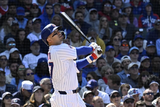 May 31, 2025; Chicago, Illinois, USA;  Chicago Cubs outfielder Seiya Suzuki (27) watches his RBI double against the Cincinnati Reds during the eighth inning at Wrigley Field. Mandatory Credit: Matt Marton-Imagn Images