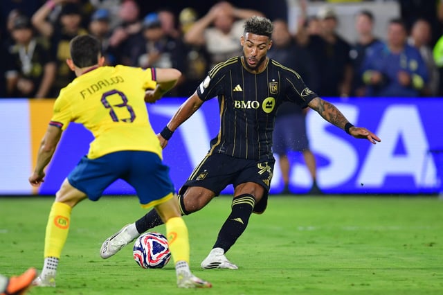 May 31, 2025; Los Angeles, California, USA; LAFC forward Denis Bouanga (99) controls the ball against Club America midfielder Alvaro Fidalgo (8) in the second half during a playoff match of the 2025 FIFA Club World Cup at BMO Stadium. Mandatory Credit: Gary A. Vasquez-Imagn Images