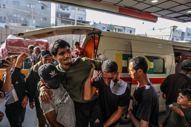 An injured man is brought to Nasser Medical Complex in Khan Younis on Sunday, after Israeli forces reportedly opened fire near an aid distribution center in southern Gaza