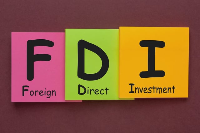 Foreign Direct Investment (FDI) written on color notes. Acronym concept. (Foreign Direct Investment