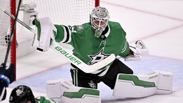 Dallas Stars goaltender Jake Oettinger (29) makes a puck save against the Winnipeg Jets during the second period in game six of the second round of the 2025 Stanley Cup Playoffs at American Airlines Center.