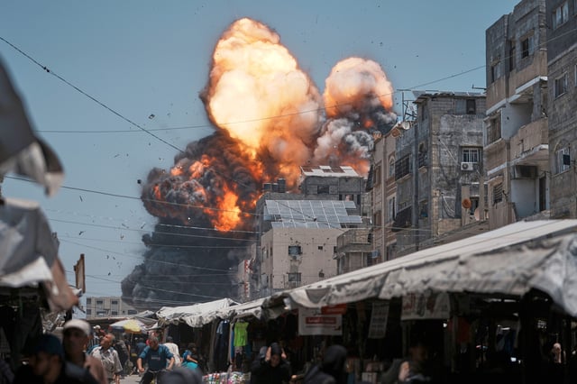 Thick smoke and flames erupt from an Israeli airstrike in Gaza City, Sunday, June 1, 2025.