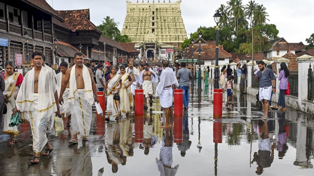 Thiruvananthapuram: People at the premises of Sree Padmanabhaswamy Temple after rainfall, in Thiruvananthapuram, Friday, May 23, 2025.