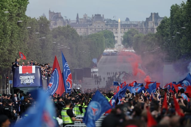 Soccer Football - Champions League - Paris St Germain Victory Parade - Paris, France - June 1, 2025 Paris St Germain players celebrate after winning the Champions League on the bus during the victory parade REUTERS/Christian Hartmann