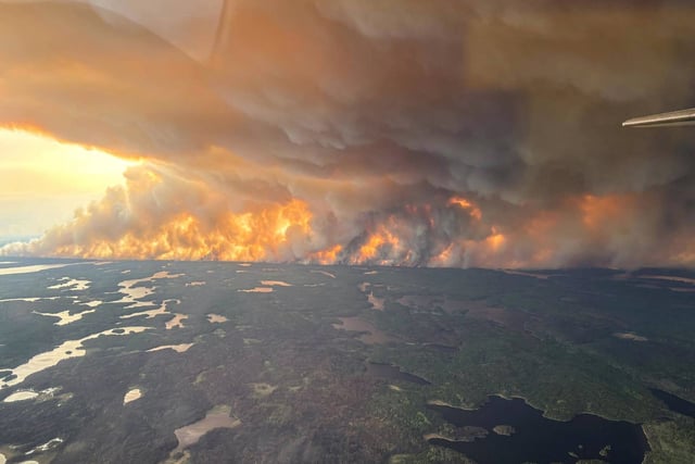 Smoke rises from a wildfire in Flin Flon, Manitoba, Canada, on May 27, 2025.
