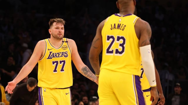 Los Angeles Lakers guard Luka Doncic (77) and forward LeBron James (23).