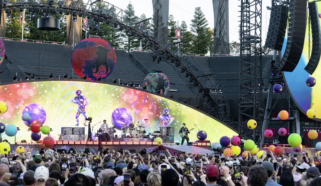 Jonny Buckland, from left, Will Champion and Guy Berryman of Coldplay at Stanford Stadium on May 31, 2025.