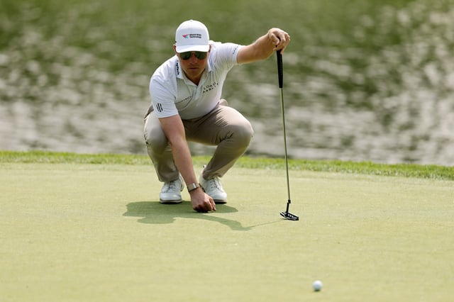 Ben Griffin of the United States lines up a putt on the third green during the third round of the Memorial Tournament presented by Workday 2025 at Muirfield Village Golf Club on May 31, 2025 in Dublin, Ohio.