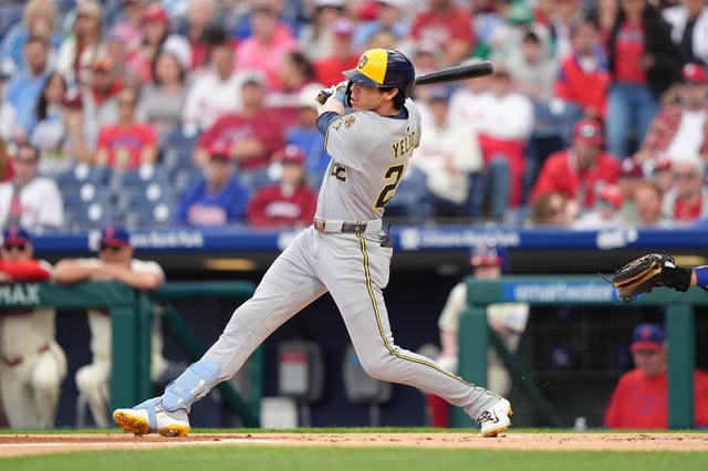 May 31, 2025; Philadelphia, Pennsylvania, USA; Milwaukee Brewers outfielder Christian Yelich (22) hits an RBI single against the Philadelphia Phillies in the first inning at Citizens Bank Park. Mandatory Credit: Kyle Ross-Imagn Images/File photo