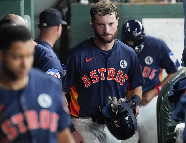 Houston Astros outfielder Jacob Melton (31) makes his way in the dugout in the sixth inning at Daikin Park in Houston on Sunday, June 1, 2025.