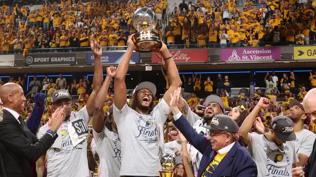 The Indiana Pacers celebrate with the Bob Cousy Eastern Conference championship trophy after defeating the New York Knicks during Game 6 of the 2025 Eastern Conference Finals.