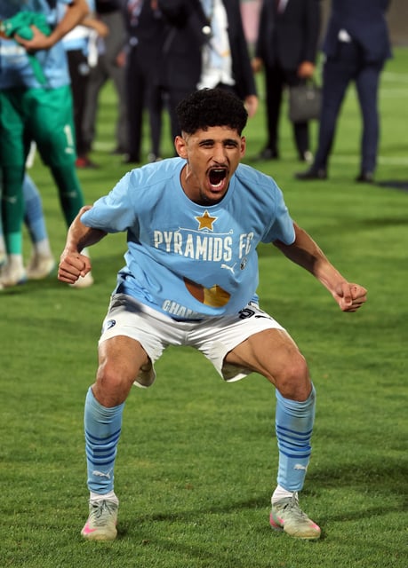 Soccer Football - CAF Champions League - Final - Second Leg - Pyramids v Mamelodi Sundowns - 30 June Stadium, Cairo, Egypt - June 1, 2025 Pyramids' Ahmed Atef celebrates after winning the CAF Champions League REUTERS/Amr Abdallah Dalsh