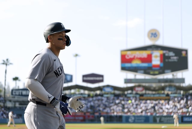 Aaron Judge #99 of the New York Yankees reacts after his solo home run, to trail 10-1 in the fourth inning ,during an 18-2 loss to the Los Angeles Dodgers at Dodger Stadium on May 31, 2025 in Los Angeles, California.