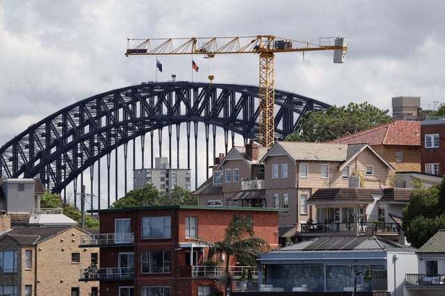 A crane is seen amongst residential properties in Sydney, Australia, March 12, 2025. REUTERS/Hollie Adams/File Photo