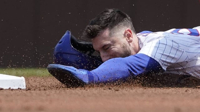 Jun 1, 2025; Chicago, Illinois, USA; Chicago Cubs outfielder Kyle Tucker (30) attempts to steal second base against the Cincinnati Reds during the first inning at Wrigley Field. Mandatory Credit: David Banks-Imagn Images
