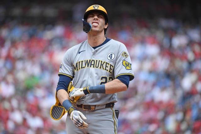 Jun 1, 2025; Philadelphia, Pennsylvania, USA; Milwaukee Brewers outfielder Christian Yelich (22) reacts after being hit by a pitch during the first inning against the Philadelphia Phillies at Citizens Bank Park. Mandatory Credit: Eric Hartline-Imagn Images
