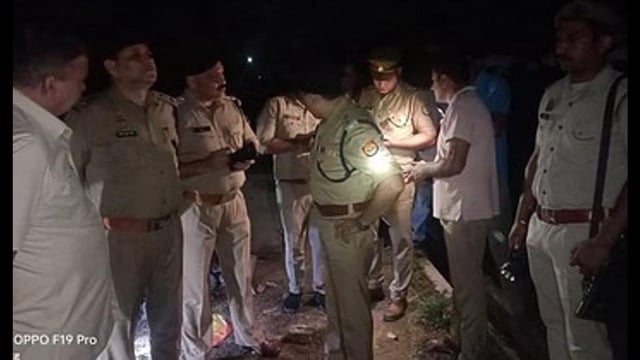 Police personnel at the spot where a 12-foot iron pipe was found on the track. (HT Photo)