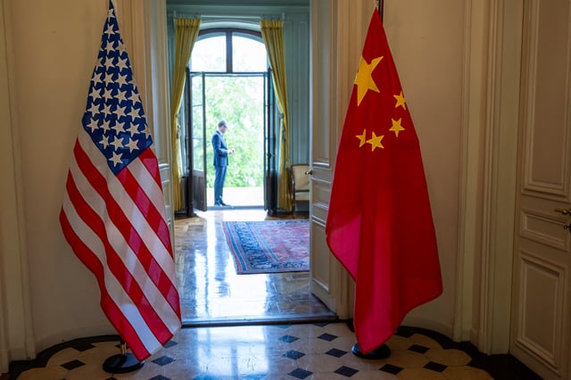 The U.S. and Chinese flags are seen on the day of a bilateral meeting between the U.S. and China, in Geneva, Switzerland, May 10, 2025. KEYSTONE/EDA/Martial Trezzini/Handout via REUTERS/File Photo