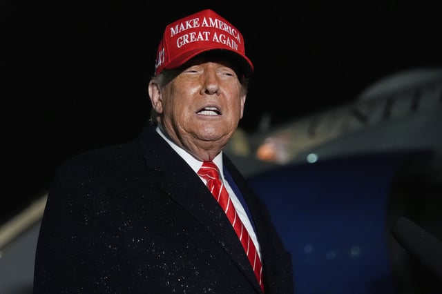 President Donald Trump speaks to reporters in the rain after arriving on Air Force One at Joint Base Andrews, Md., Friday, May 30, 2025.