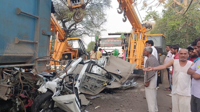 The mangled remains of the car after it rammed into the truck near Unhani village in Mahendergarh early on Monday. (HT Photo)