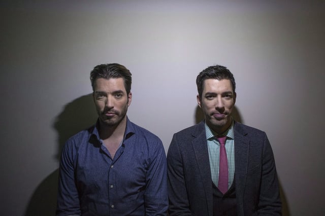 Jonathan, left, and Drew Scott pose for a photo as they promote the new television series "Property Brothers at Home" in Toronto on Tuesday, Nov. 4, 2014.  THE CANADIAN PRESS/Chris Young
