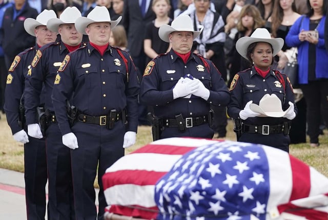 Harris County Constable Precinct 5 honor guard members stand by the casket of Pct. 5 Corporal Charles Galloway during a service outside the Second Baptist Church West Campus, 19449 Katy Freeway, Tuesday, Feb. 1, 2022 in Houston. 