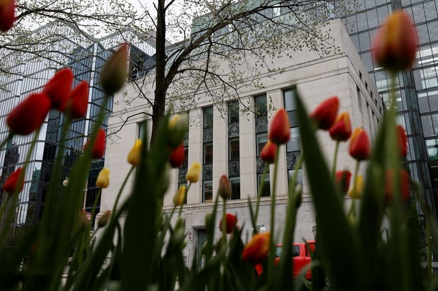 A view of the Bank of Canada building framed by tulips in Ottawa, Ontario, Canada May 8, 2025. REUTERS/Blair Gable/File Photo