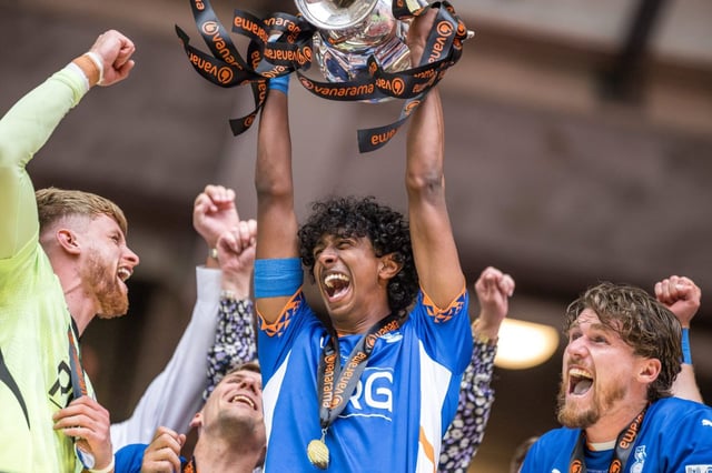 Vimal Yoganathan of Oldham Athletic lifts the National League trophy (Photo: Getty)
