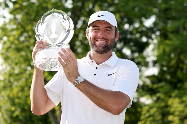 cottie Scheffler of the United States poses with the trophy after winning the Memorial Tournament presented by Workday 2025 at Muirfield Village Golf Club on June 01, 2025 in Dublin, Ohio.