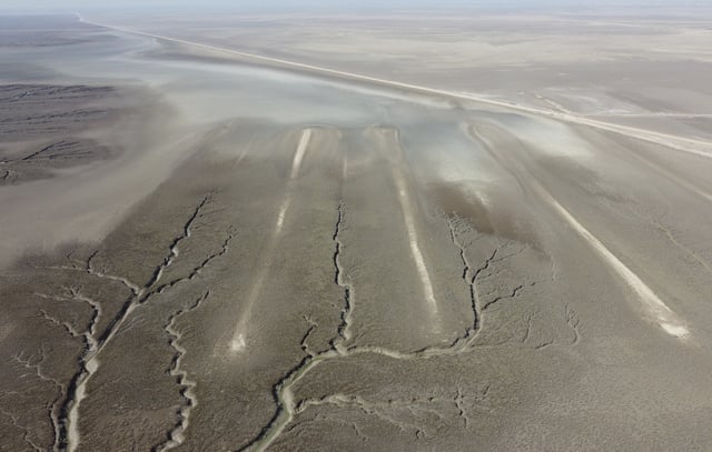 An aerial photo shows an archaeological site where researchers uncovered massive earthen structures, believed to have been built with slave labor, and found that their construction spanned several centuries, near Basra, Iraq, Saturday, Jan. 29, 2022. (AP Photo/Jaafar Jotheri)
