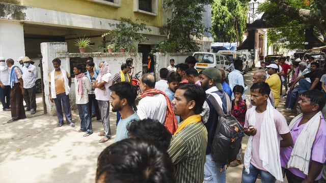 People gather outside the post-mortem department after the death of a minor girl undergoing treatment at PMCH, in Patna, 