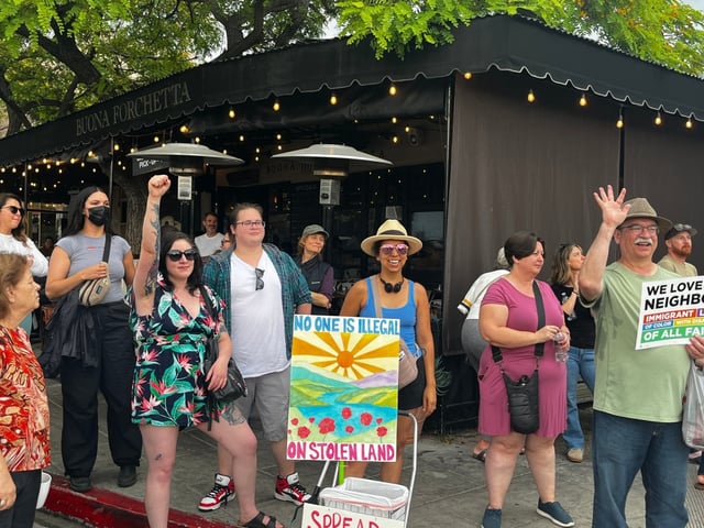 People show up for a hastily organized rally outside Buona Forchetta in South Park a day after a raid by ICE agents. (Lori Weisberg)