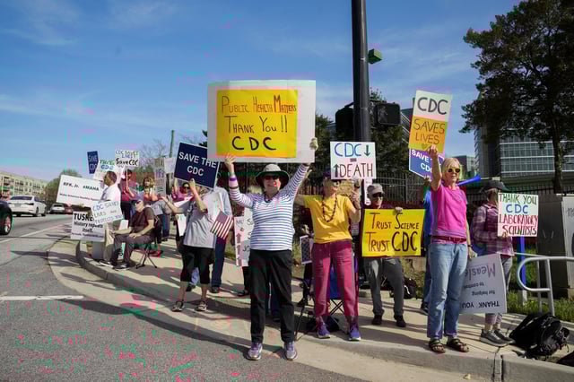 Demonstrators protest outside the Center for Disease Control, in Atlanta, after the Trump administration began mass layoffs of 10,000 staffers at U.S. health agencies under the Department of Health and Human Services, including the FDA, CDC and the National Institutes of Health, in Atlanta, Georgia, U.S. April 1, 2025.  REUTERS/Megan Varner/File Photo