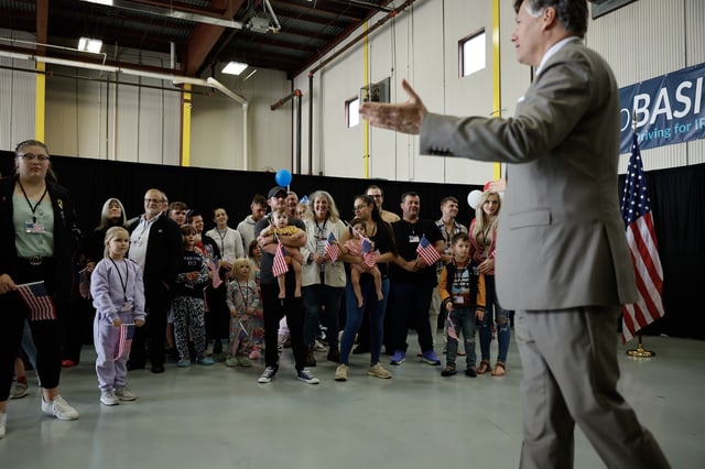 DULLES, VIRGINIA - MAY 12: Newly arrived white South Africans, also called Afrikaners, are welcomed by U.S. Deputy Secretary of State Christopher Landau in a hangar at Atlantic Aviation Dulles near Washington Dulles International Airport on May 12, 2025 in Dulles, Virginia.