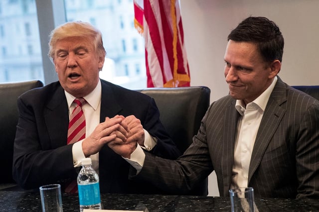 President-elect Donald Trump shakes the hand of Peter Thiel during a meeting with technology executives at Trump Tower, December 14, 2016 in New York City.