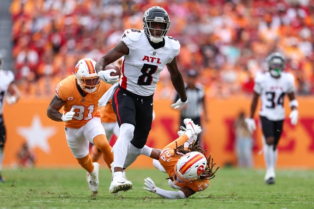 Oct 27, 2024; Tampa, Florida, USA;Atlanta Falcons tight end Kyle Pitts (8) holds off Tampa Bay Buccaneers cornerback Tyrek Funderburk (24) in the second quarter  at Raymond James Stadium. Mandatory Credit: Nathan Ray Seebeck-Imagn Images