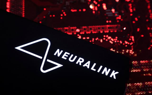 A smartphone with a Neuralink logo displayed is placed on a computer motherboard in this illustration taken on May 15, 2024. REUTERS/Dado Ruvic/Illustration/File Photo