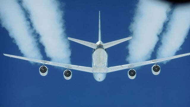 Contrails produced by aircraft.