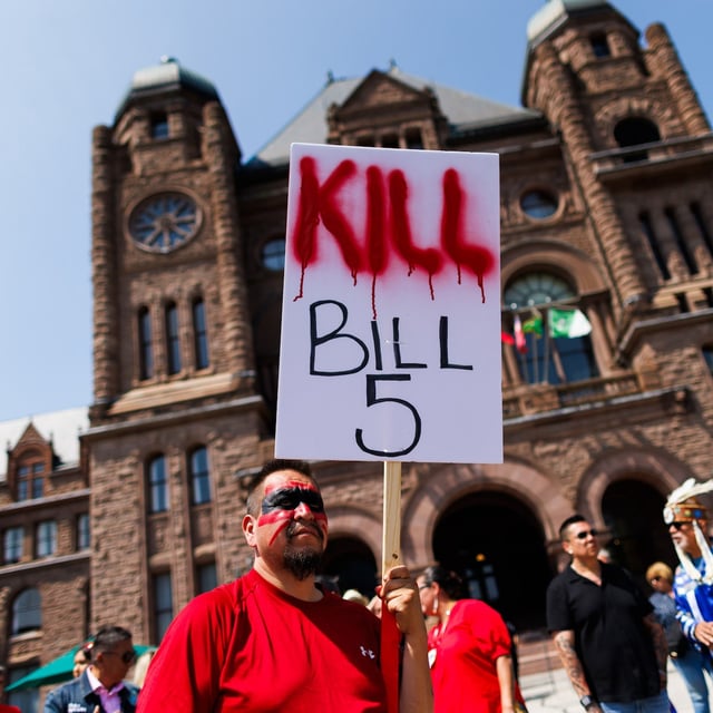 First Nations members protest on the front lawn of Queen’s Park on June 2. First Nations say the bill tramples their rights and ignores their concerns.
