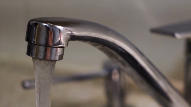 File photo of a faucet with running water. 