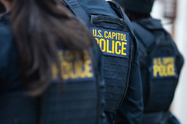 Capitol Police officers wait to board the Senate subway.