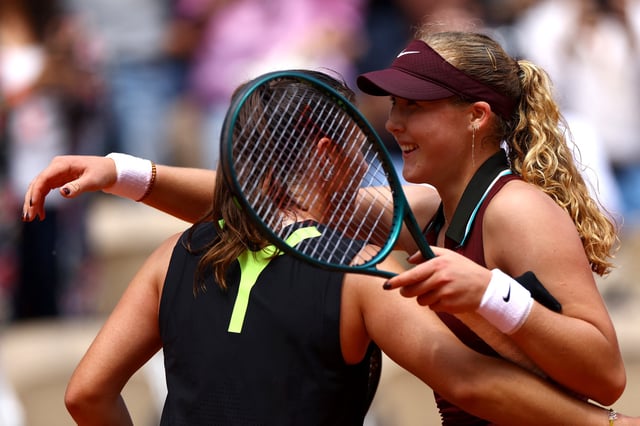 Tennis - French Open - Roland Garros, Paris, France - June 2, 2025 Russia's Mirra Andreeva hugs Australia's Daria Kasatkina after winning her fourth round match REUTERS/Lisi Niesner