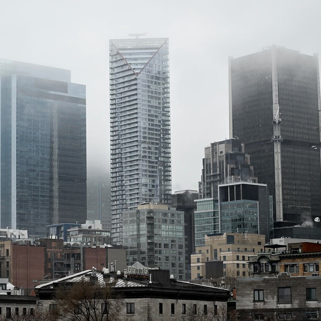 Fog hangs over the skyline of Montreal on Jan. 1, 2025. THE CANADIAN PRESS/Graham Hughes.